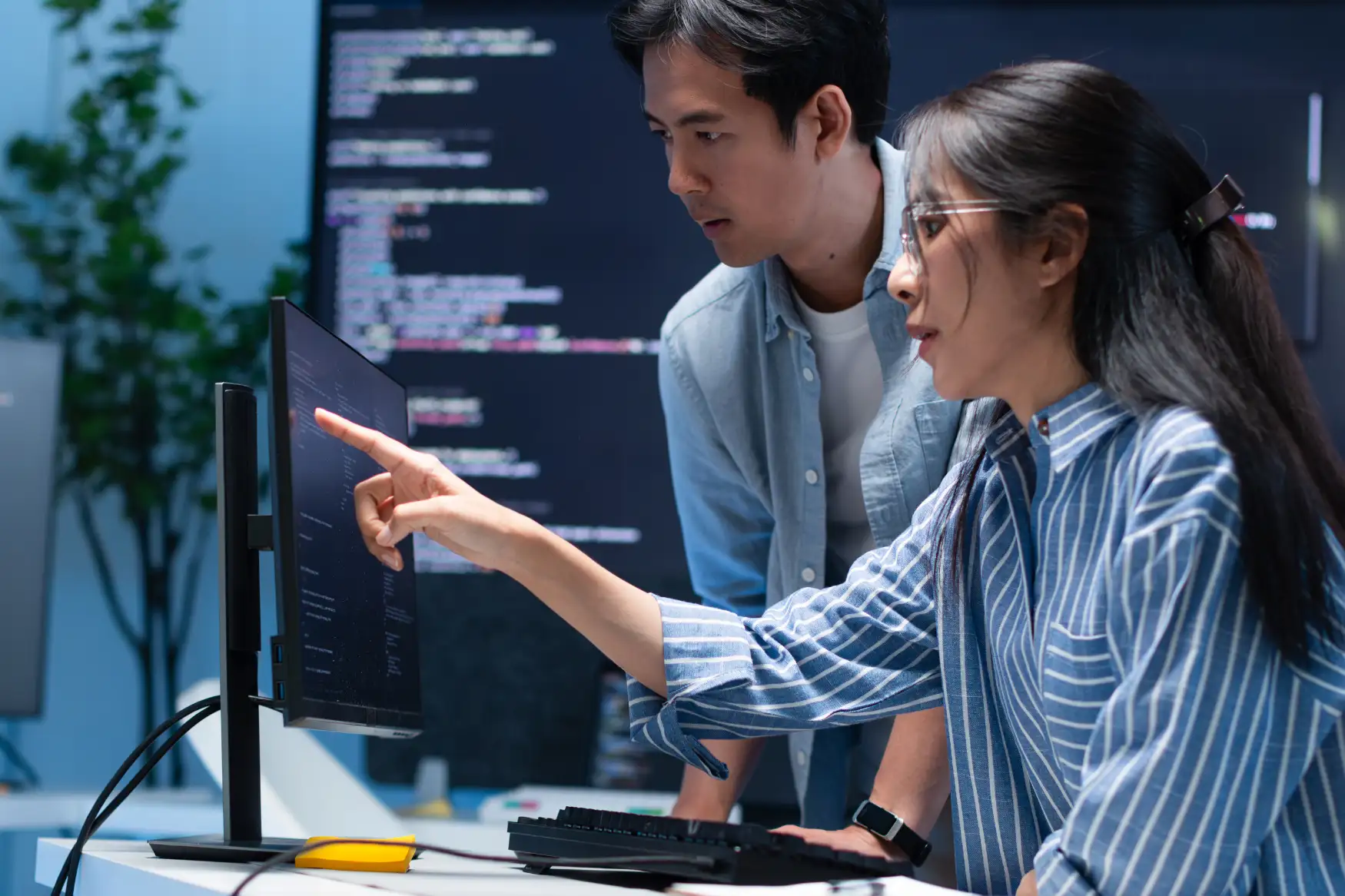 Collaborating developers reviewing WordPress theme code